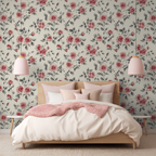 Bedroom with floral wallpaper, bed, and pink lamps.