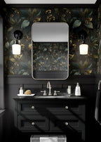 Modern bathroom with black vanity, floral wallpaper, and decorative elements.