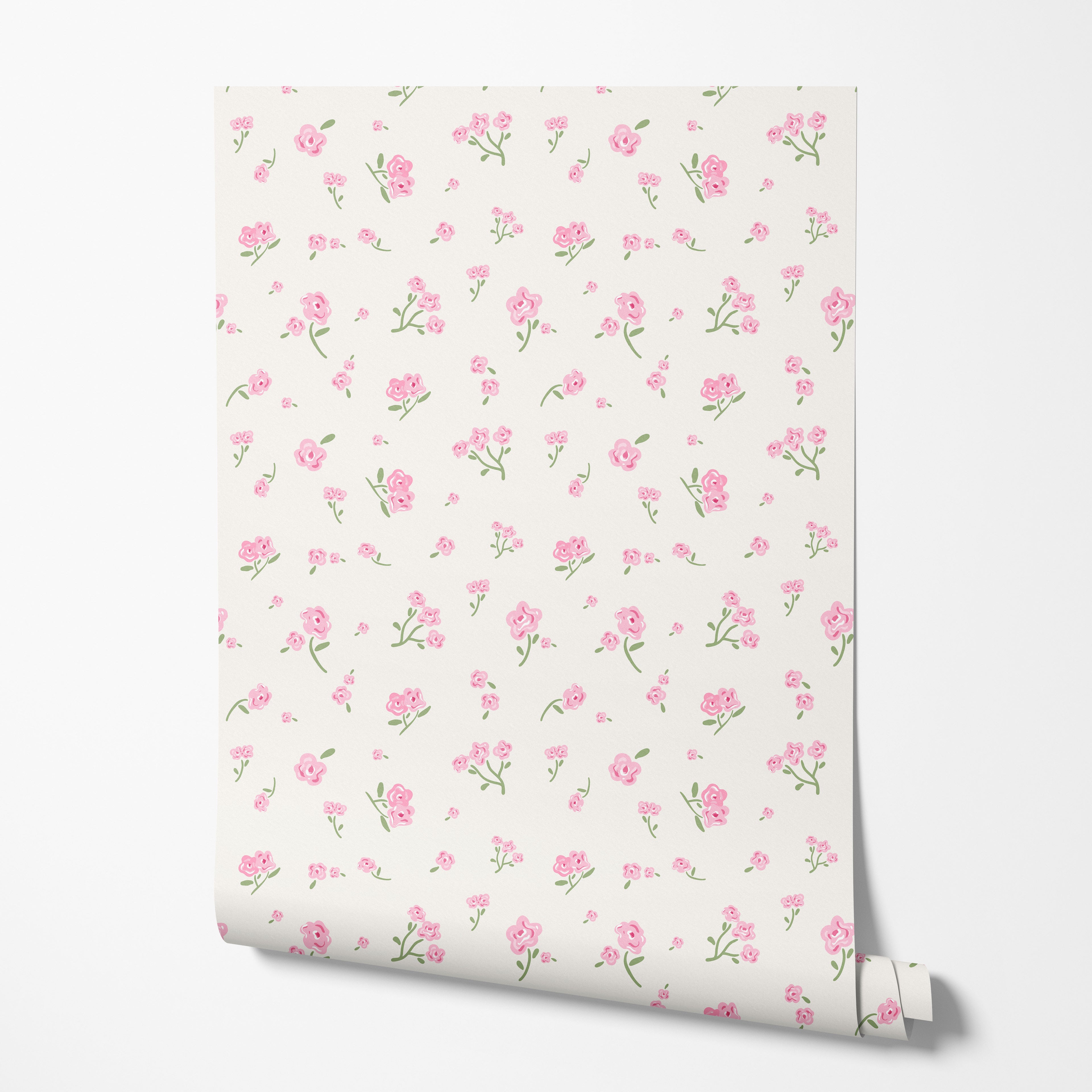 Roll of floral wallpaper with pink flowers on a white background